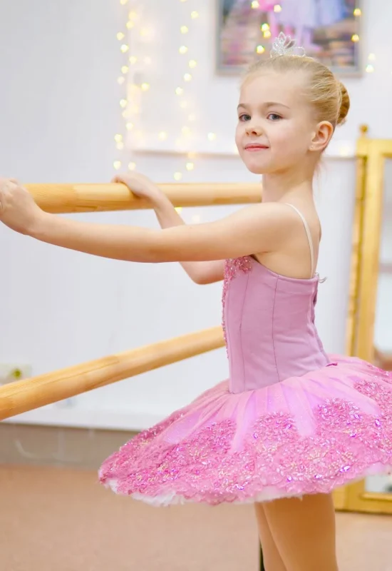 Children taking a classical ballet class at a dance school in Madrid